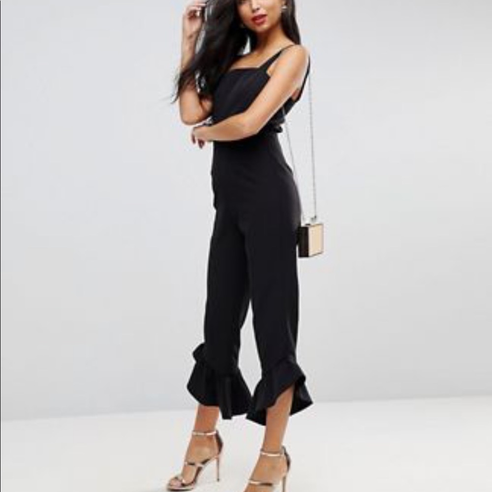 Black jumpsuit with square neck and frill hem